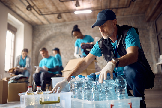 People distribute water as a charity activity